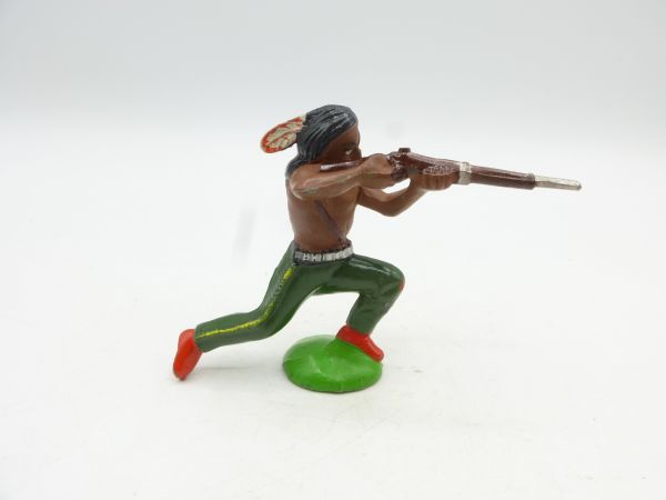 Indian kneeling shooting rifle, green trousers