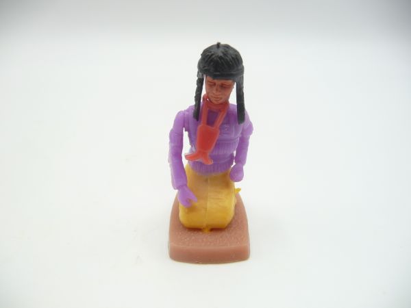Plasty Indian woman kneeling