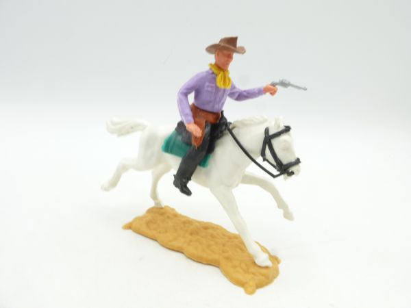 Timpo Toys Cowboy 2nd version riding, shooting pistol (lilac)