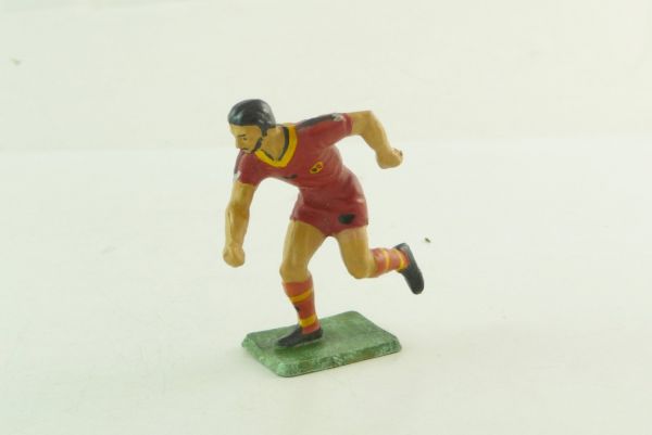 Starlux Footballer storming forward - early figure, great painting
