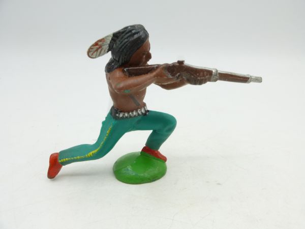 Indian kneeling, shooting rifle - rare colour