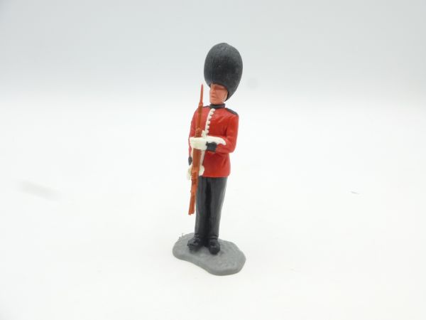 Timpo Toys Guardsman standing, presenting rare brown rifle