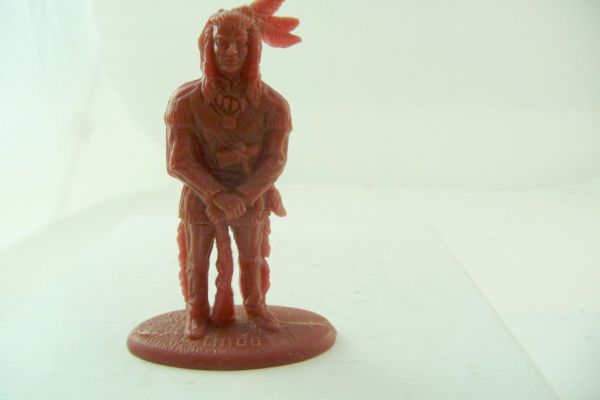 Linde Indian standing, rifle put down, dark-brown