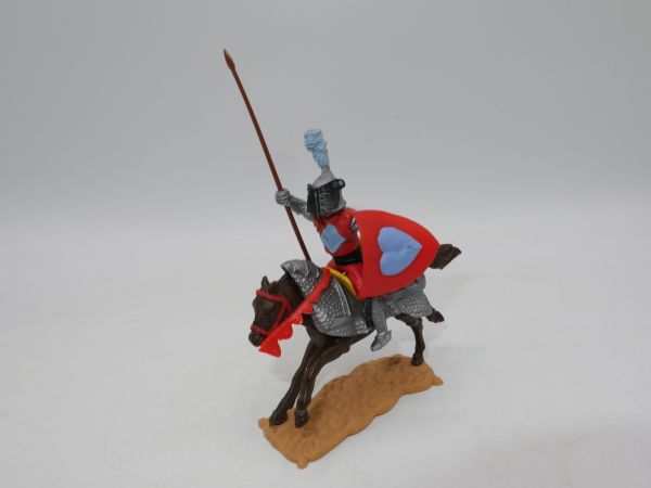 Timpo Toys Visor knight riding, red/light blue with lance on armoured horse