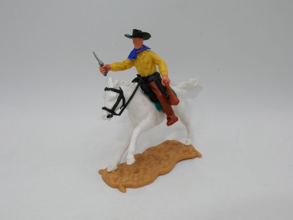 Timpo Toys Cowboy riding, with pistol + money bag
