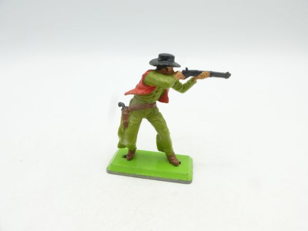 Britains Deetail Cowboy standing with hat, shooting rifle