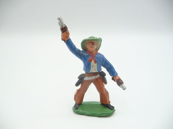 Cowboy standing, firing 2 pistols into the air