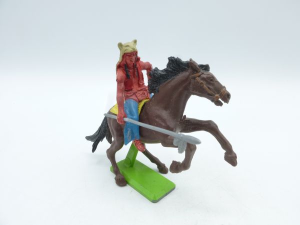 Britains Deetail Indian riding, holding spear sideways, with bear skin