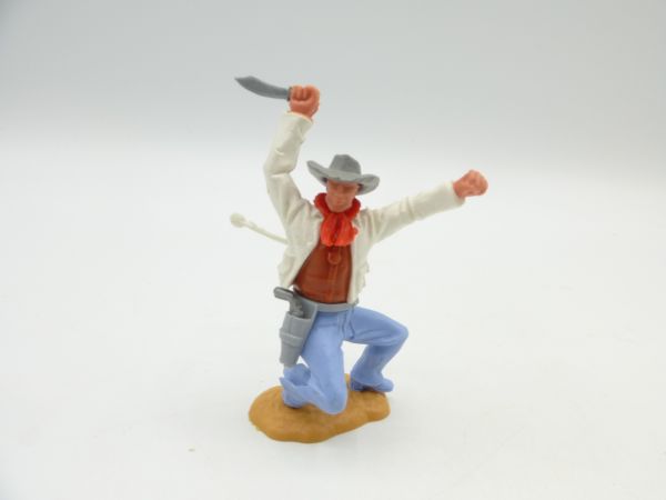 Timpo Toys Cowboy 2. Version hockend, von Pfeil getroffen (weiße Jacke, braunes Hemd)