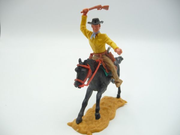 Timpo Toys Cowboy 3rd version riding, striking with rifle