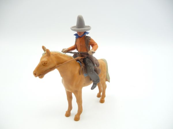Britains Swoppets Cowboy on standing horse, rifle in front of body
