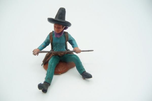 Britains Swoppets Mexican sitting with rifle, turquoise shirt