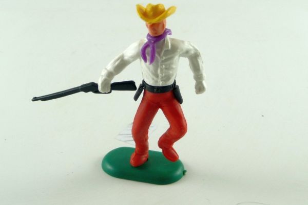Crescent Cowboy standing with rifle