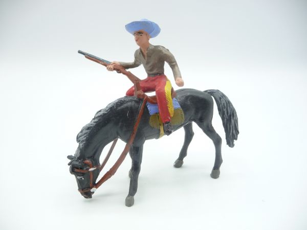 Merten Cowboy reitend auf erschöpftem Pferd - tolle Figur