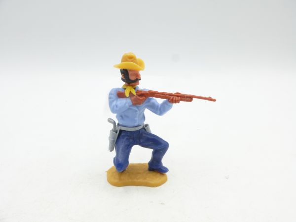 Timpo Toys Cowboy 3. Version hockend, Gewehr schießend