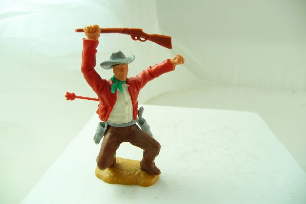Timpo Toys Cowboy 3. Version hockend, von Pfeil getroffen
