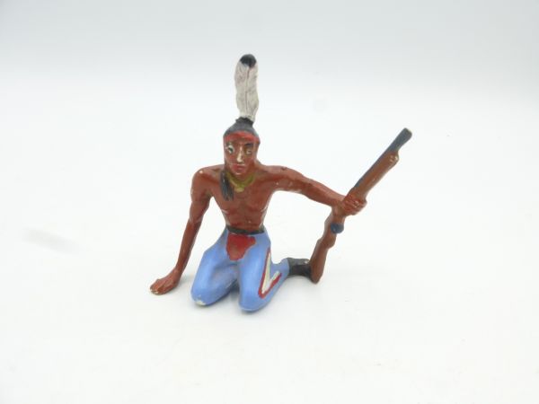 Merten Indian sitting with rifle