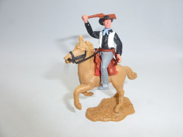 Timpo Toys Cowboy 2. Version reitend, Gewehr schlagend