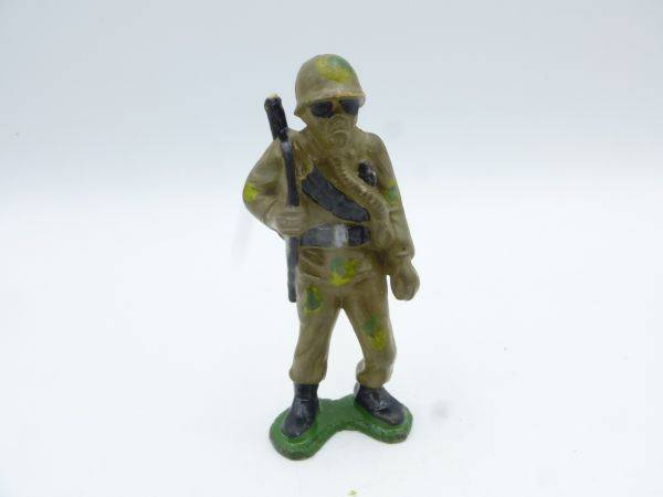 Heimo Soldier standing with breathing mask, rifle shouldered