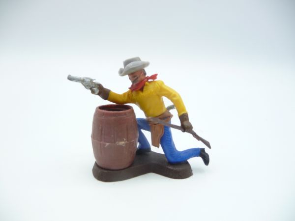 Britains Swoppets Cowboy with pistol + aiming with rifle, behind barrel