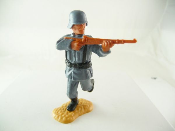 Timpo Toys German soldier firing with rifle, fixed helmet