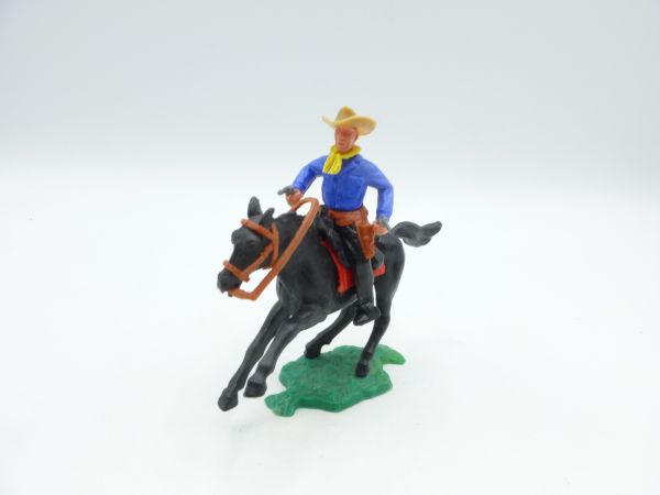 Timpo Toys Cowboy riding, firing 2 pistols