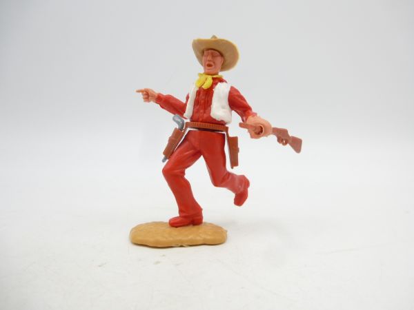 Timpo Toys Cowboy 2nd version walking with rifle, pointing