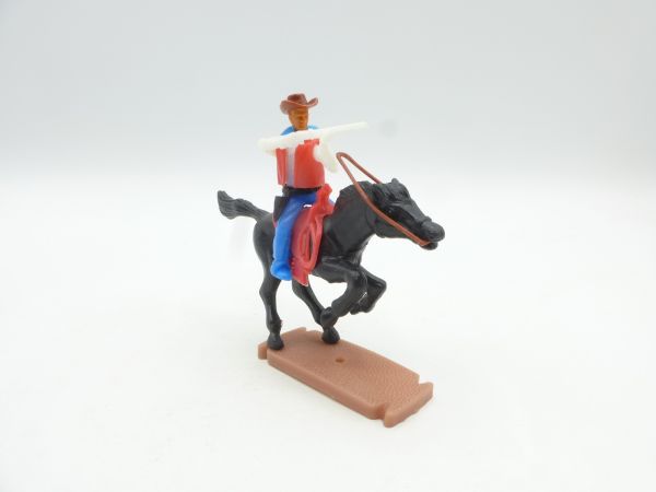 Plasty Cowboy riding shooting with rifle