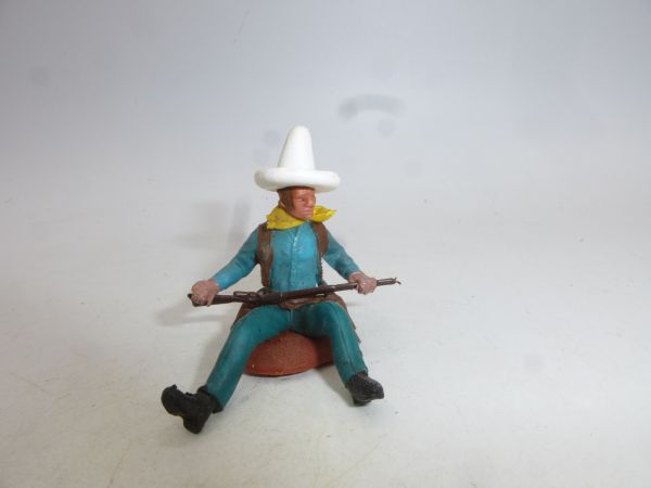 Britains Swoppets Cowboy sitting on a tree trunk, white Stetson