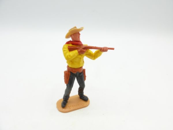 Timpo Toys Cowboy 2nd version standing with short rifle, upper part yellow