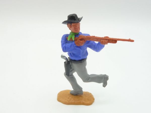 Timpo Toys Cowboy 3. Version laufend, Gewehr schießend, mittelblau