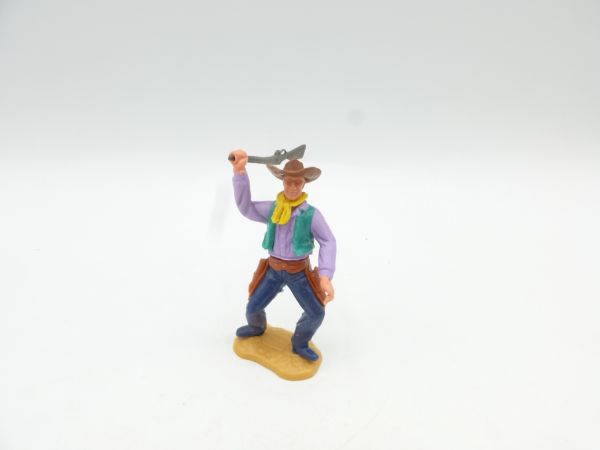 Timpo Toys Cowboy 2nd version standing, striking rifle over head