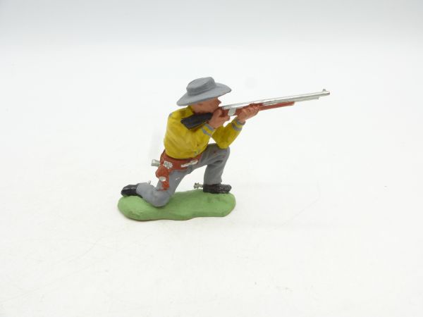 Britains Swoppets Cowboy kneeling shooting, yellow (made in HK)