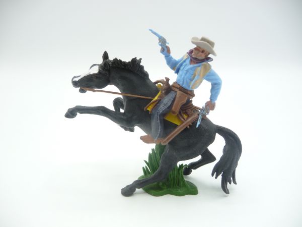 Britains Swoppets Cowboy riding with 2 pistols - on a great rearing horse