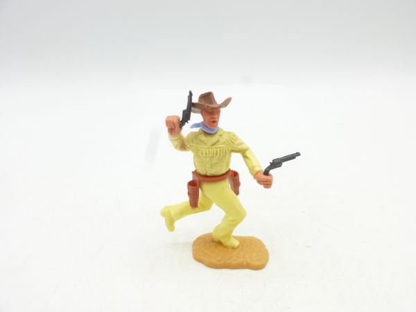 Timpo Toys Cowboy 2nd version running with 2 black pistols