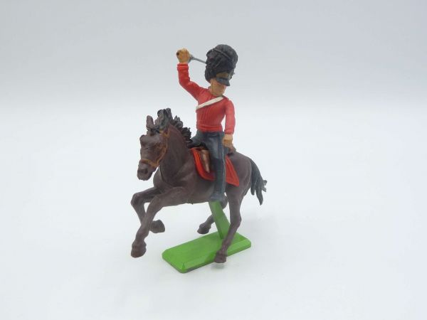 Britains Deetail Waterloo; soldier riding, red, striking with sabre from above, looking to the left