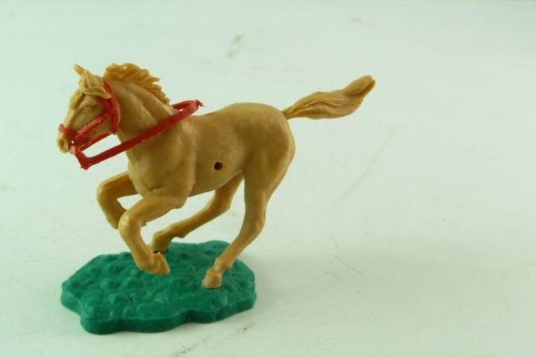 Timpo Toys Kurz galoppierendes, beiges Pferd mit rotem Zaumzeug