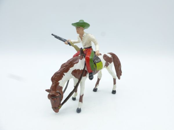 Merten Cowboy on grazing mustang, rifle at side