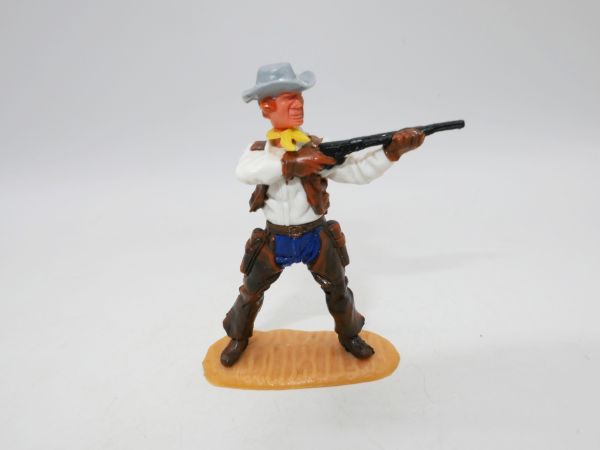 Timpo Toys Cowboy 4. Version stehend Gewehr schießend, mit Chaps