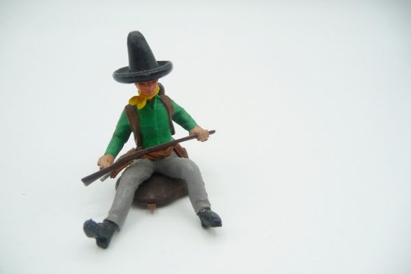 Britains Swoppets Mexican sitting with rifle, green shirt