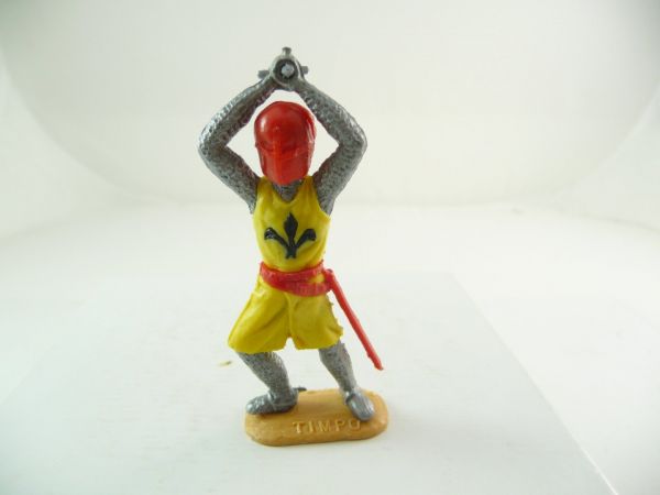 Timpo Toys Medieval knight striking with sword ambidextrous over head, yellow/red