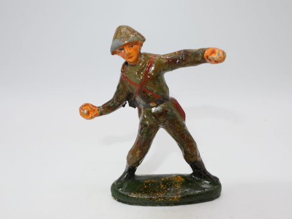 Soldier throwing hand grenade