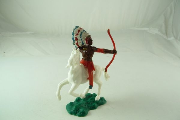 Crescent Indian Chief mounted, shooting with bow