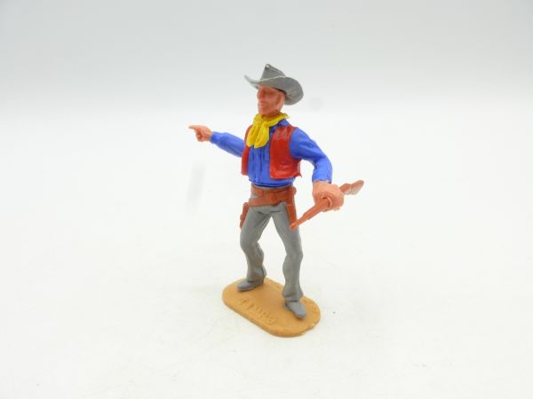 Timpo Toys Cowboy stehend mit Gewehr, seitlich zeigend