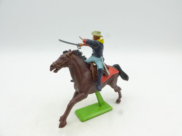 Britains Deetail Soldier 7th Cavalry riding, firing rifle over sabre
