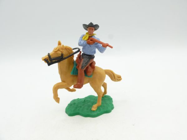 Timpo Toys Cowboy 2. Version reitend, kurzes Gewehr schießend