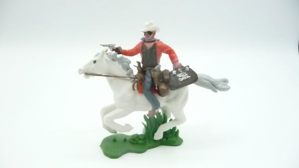 Britains Swoppets Cowboy riding firing with pistol + money bag