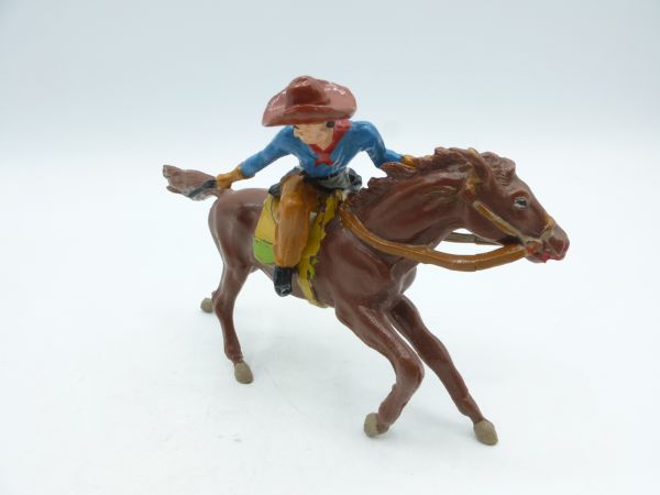 Merten Cowboy riding with gun shooting backwards