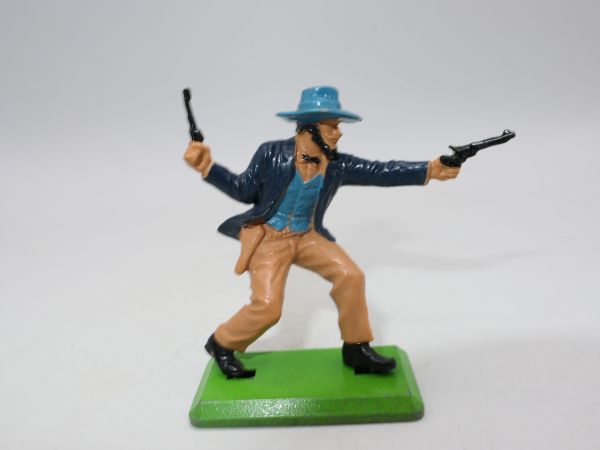 Britains Deetail Cowboy leading with 2 pistols, dark blue jacket