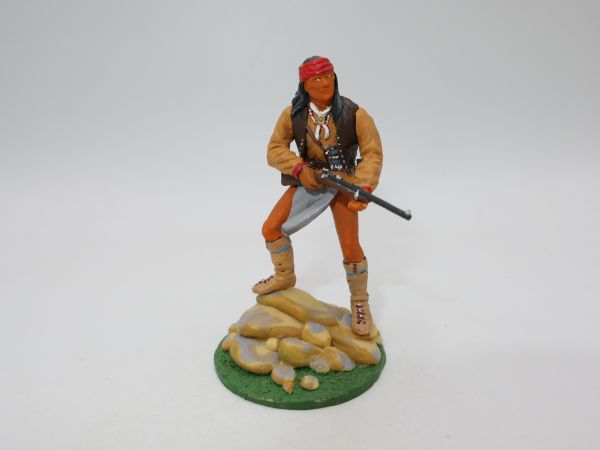 Indian with rifle standing on stone hill (5,4 cm series)